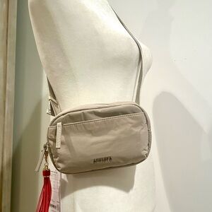ATHLETA Crossbody Bag with Red Tassel